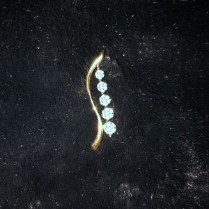 Diamond and gold journey pendant.